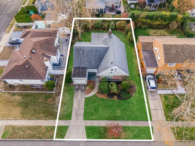 an aerial view of house with yard
