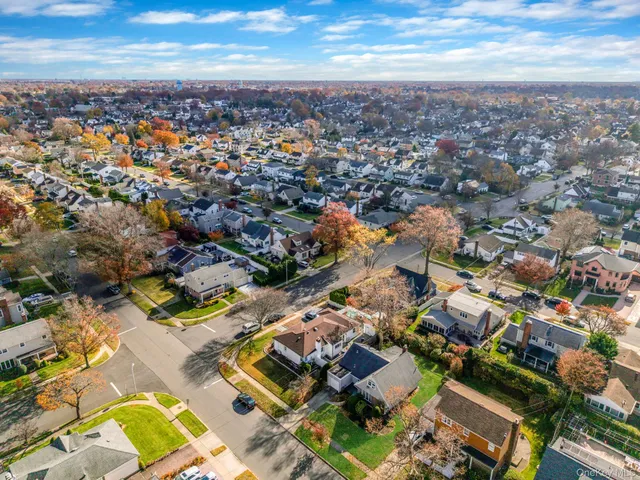 an aerial view of residential building with parking space