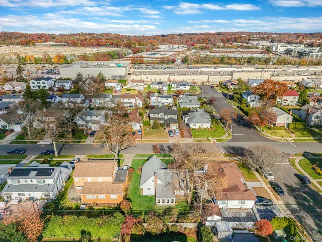 an aerial view of residential building and lake
