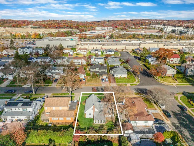 an aerial view of residential building and lake view