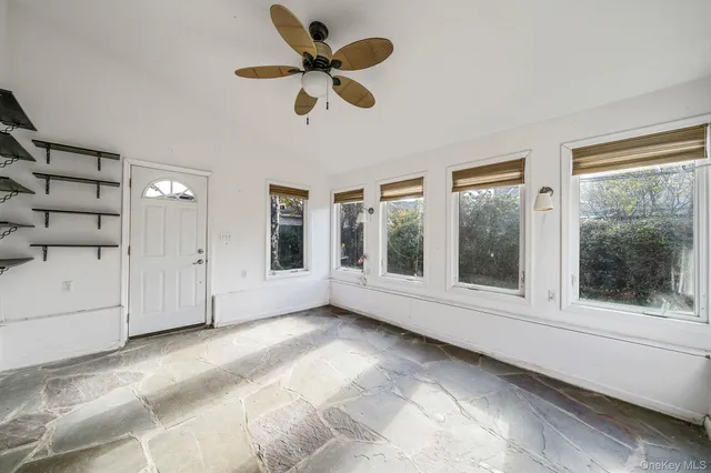 a view of an empty room with a window