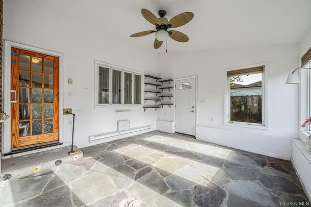 a view of an empty room with a window