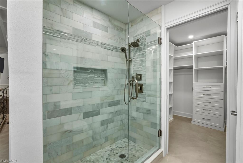 453 18th Avenue South Naples, FL 34102 - Photo 13 of 47 a bathroom with a shower