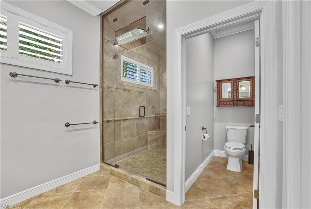 453 18th Avenue South Naples, FL 34102 - Photo 27 of 47 a bathroom with a toilet and a shower
