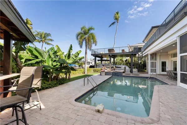 a view of a swimming pool with a lounge chair