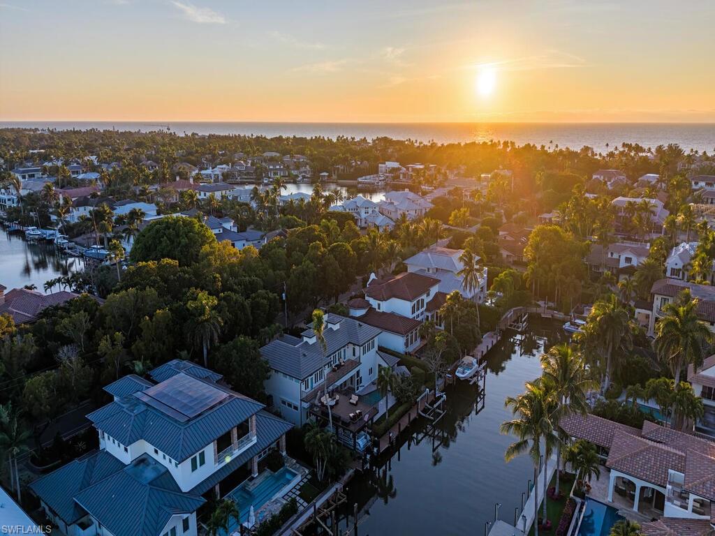 453 18th Avenue South Naples, FL 34102 - Photo 46 of 47 an aerial view of residential houses with outdoor space and trees