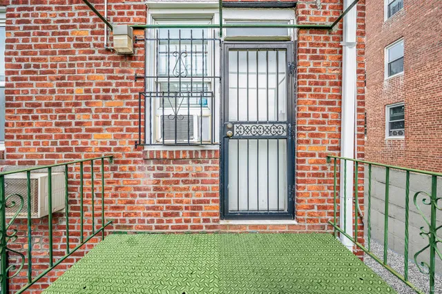 a view of a building with stairs and a floor to ceiling window