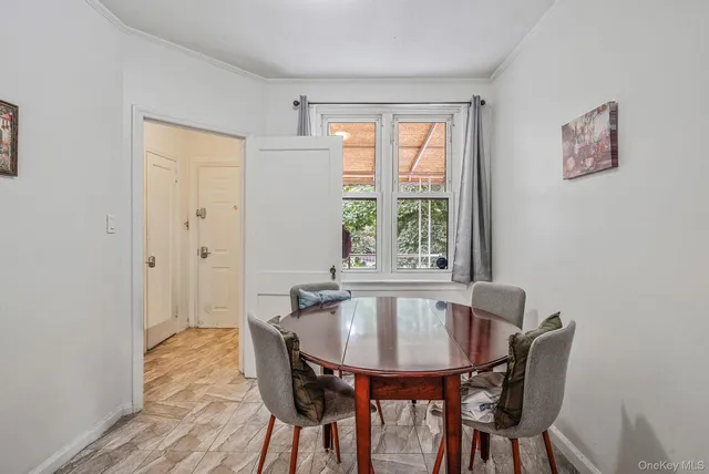 a kitchen with stainless steel appliances granite countertop a sink and a stove top oven with white cabinets