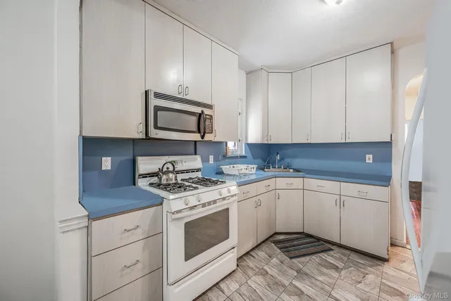 a view of kitchen with furniture and window