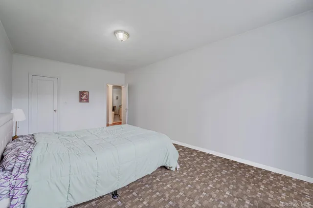 a room with furniture and a book shelf