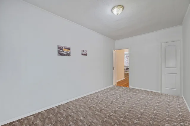 a bathroom with a toilet sink vanity and mirror