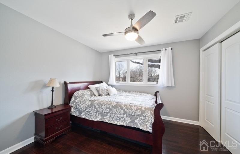3 South Gate Springfield, NJ 07081 - Photo 13 of 22 a bedroom with a bed and wooden floor