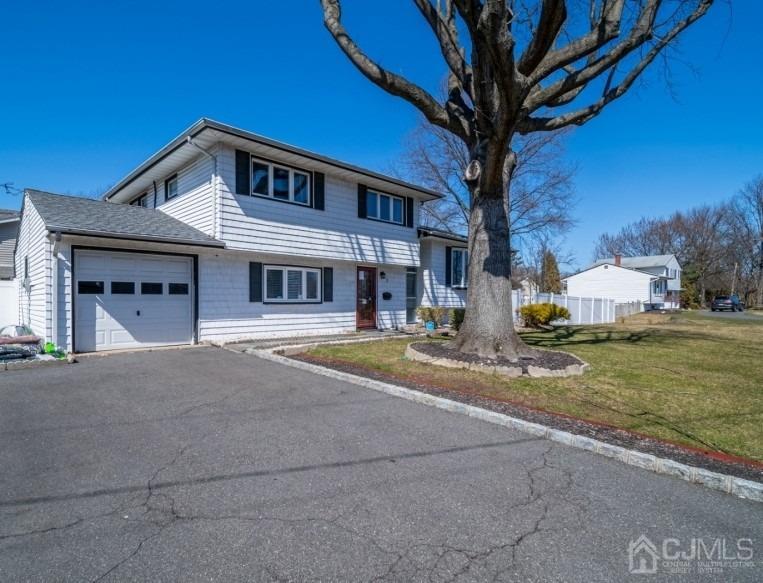 3 South Gate Springfield, NJ 07081 - Photo 4 of 22 a front view of a house with a yard