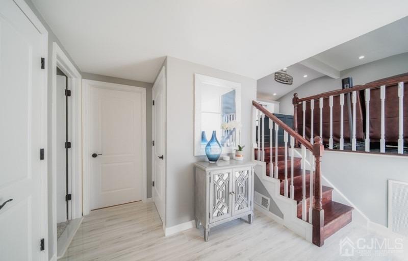 3 South Gate Springfield, NJ 07081 - Photo 5 of 22 a view of a hallway with windows and stairs