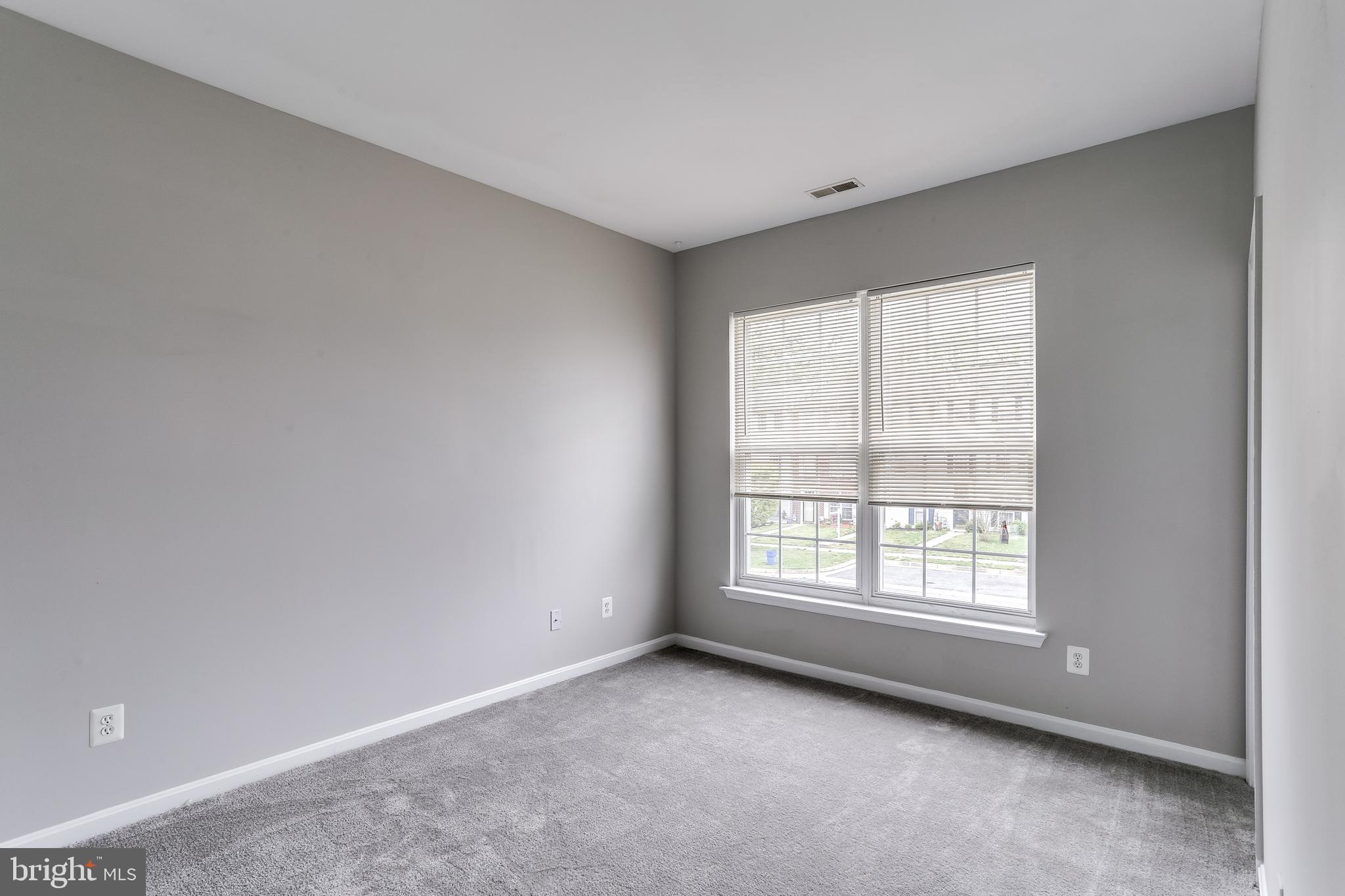 673 Hunting Fields Road Baltimore, MD 21220 - Photo 21 of 31 a view of an empty room with a window