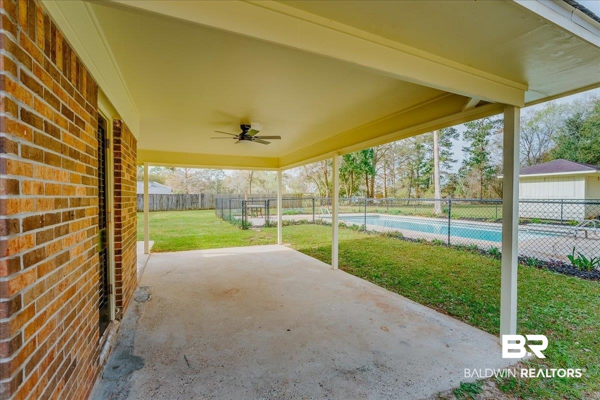 440 Dykes Road Mobile, AL 36608 - Photo 40 of 49 View of patio / terrace featuring a fenced in pool, a ceiling fan, and fence