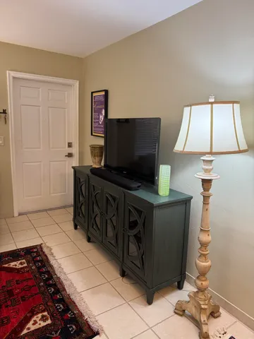 a room with furniture and flat screen tv