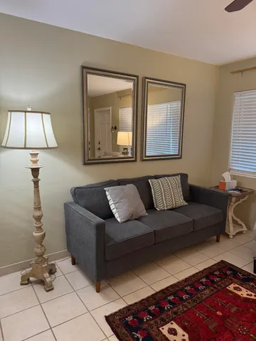 a living room with a couch and a table