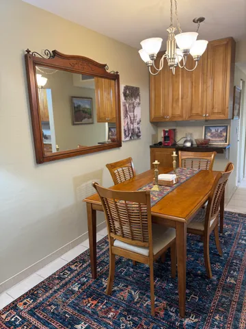 a dinning table and chairs in a kitchen