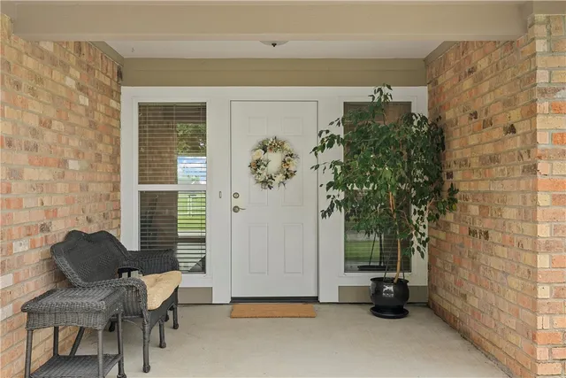 a living room with furniture ceiling fan and a rug