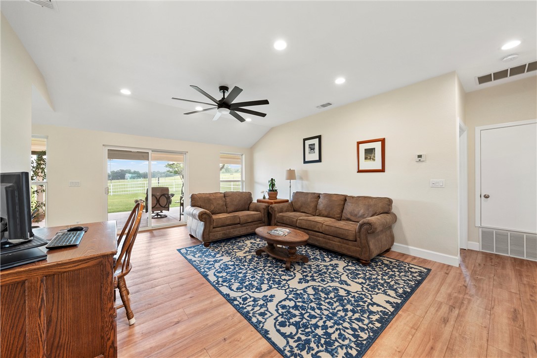 1748 Downsville Road Robinson, TX 76706 - Photo 14 of 65 a living room with furniture and a wooden floor
