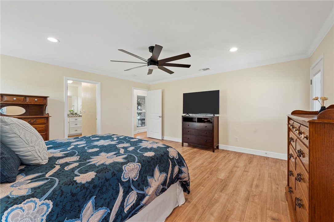 1748 Downsville Road Robinson, TX 76706 - Photo 22 of 65 a bedroom with a bed and a television