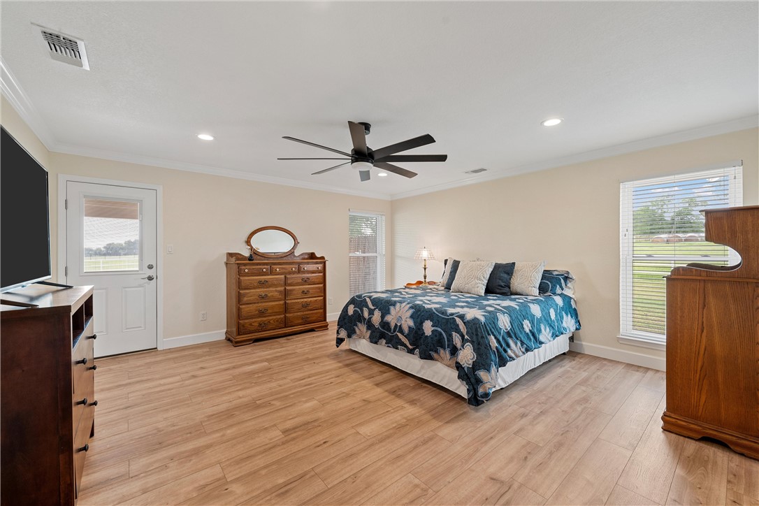 1748 Downsville Road Robinson, TX 76706 - Photo 23 of 65 a bedroom with a bed window and a mirror