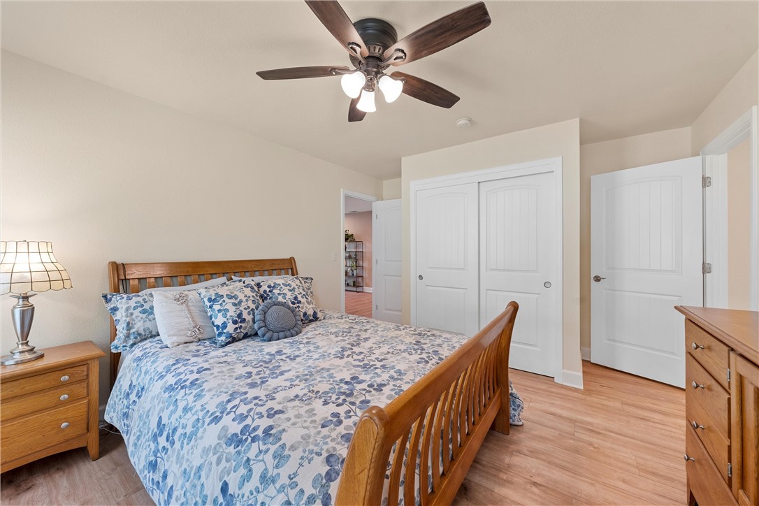 1748 Downsville Road Robinson, TX 76706 - Photo 25 of 65 a bed room with a bed and a ceiling fan
