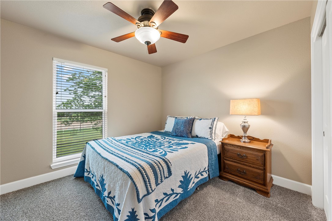 1748 Downsville Road Robinson, TX 76706 - Photo 33 of 65 a bedroom with a bed and a window