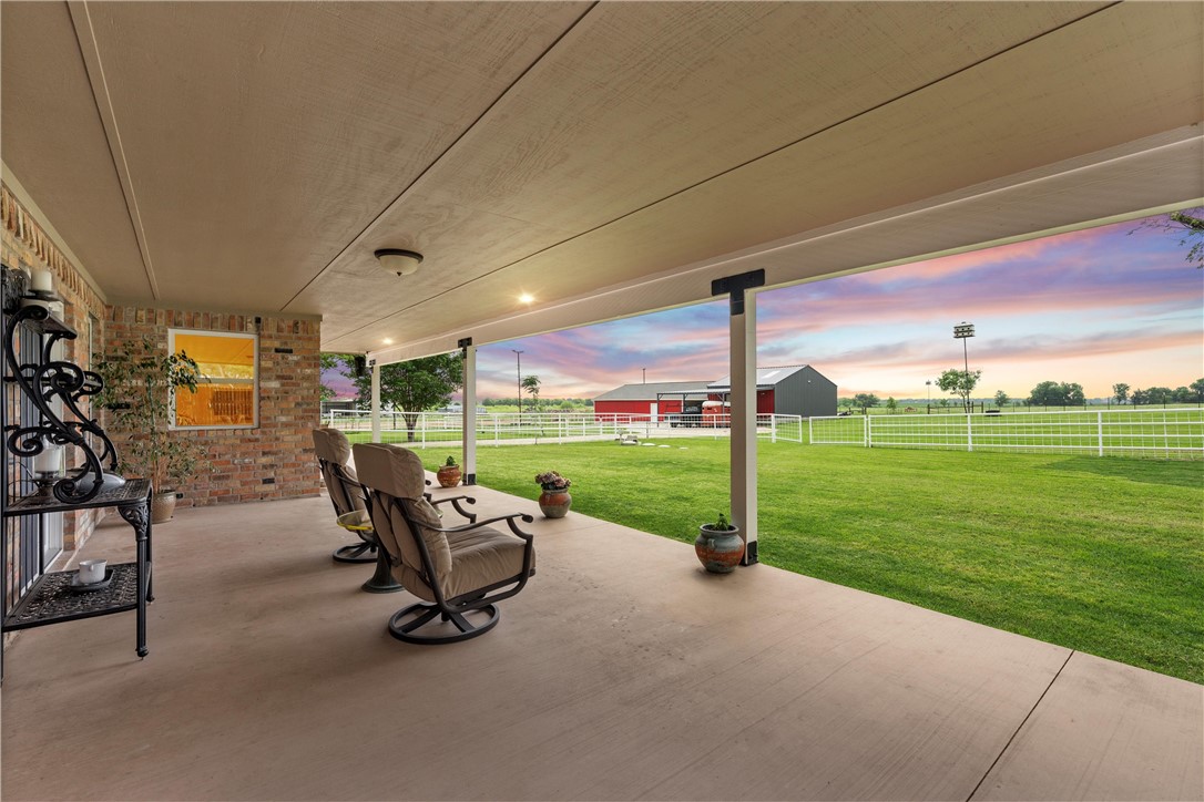 1748 Downsville Road Robinson, TX 76706 - Photo 8 of 65 a view of a patio with a table chairs and a yard