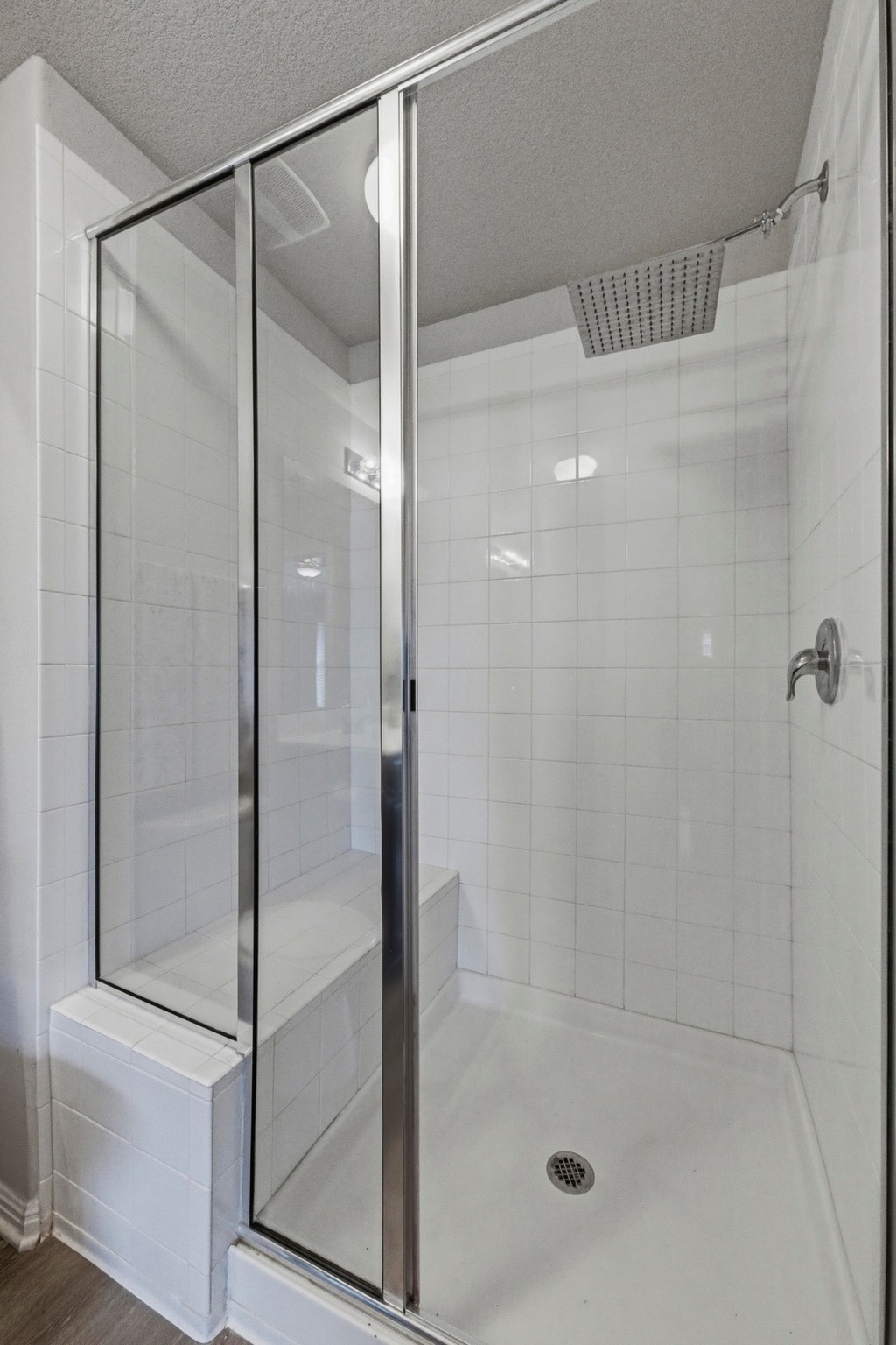 516 East Slaughter Lane, Unit 2402 Austin, TX 78744 - Photo 13 of 27 a bathroom with a glass shower door