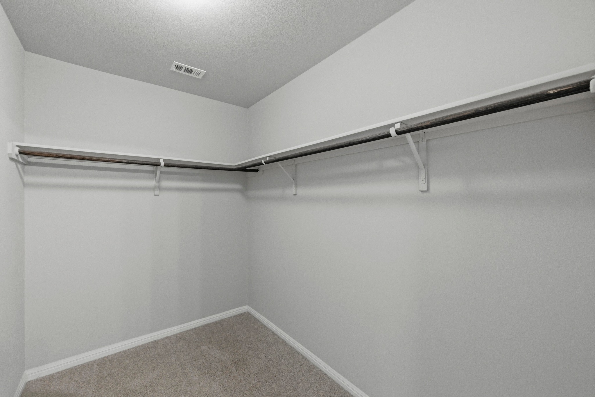 516 East Slaughter Lane, Unit 2402 Austin, TX 78744 - Photo 15 of 27 a view of a room with racks on the wall