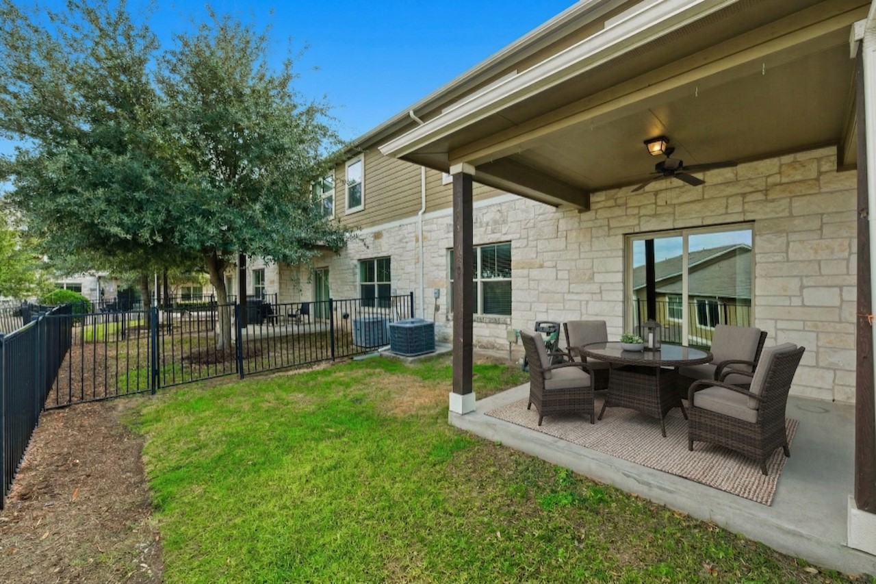 516 East Slaughter Lane, Unit 2402 Austin, TX 78744 - Photo 20 of 27 a view of a house with backyard and a patio