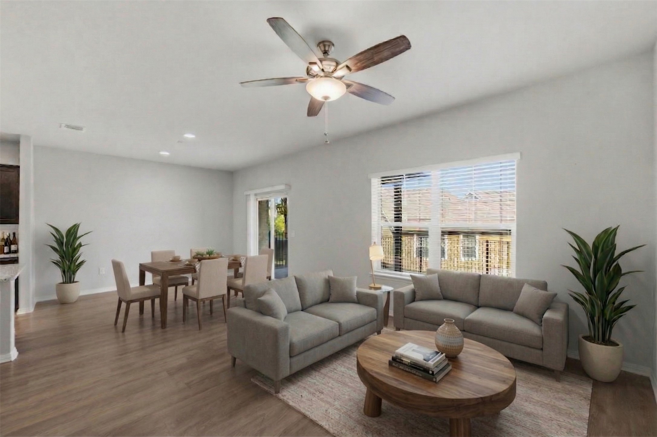 516 East Slaughter Lane, Unit 2402 Austin, TX 78744 - Photo 4 of 27 a living room with furniture and wooden floor