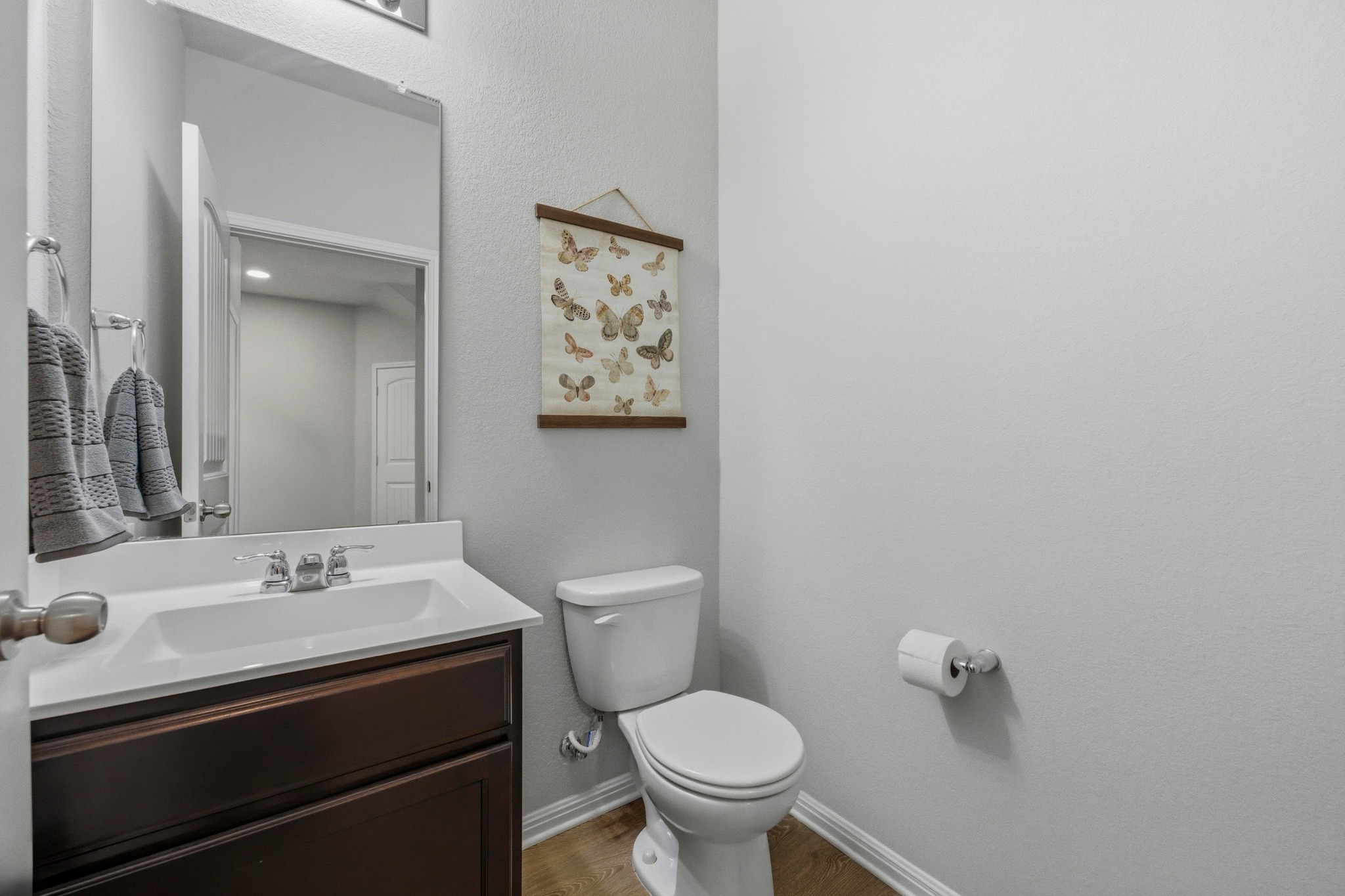 516 East Slaughter Lane, Unit 2402 Austin, TX 78744 - Photo 9 of 27 a bathroom with a sink toilet and mirror