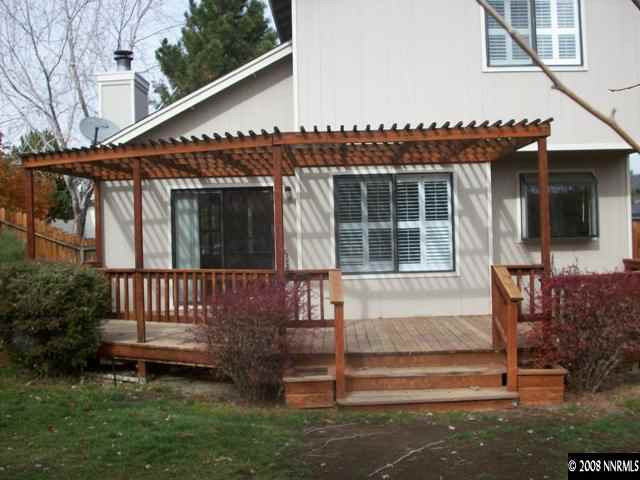 5898 Walnut Creek Road Reno, NV 89523 - Photo 8 of 8 a view of a house with a small deck and a garden
