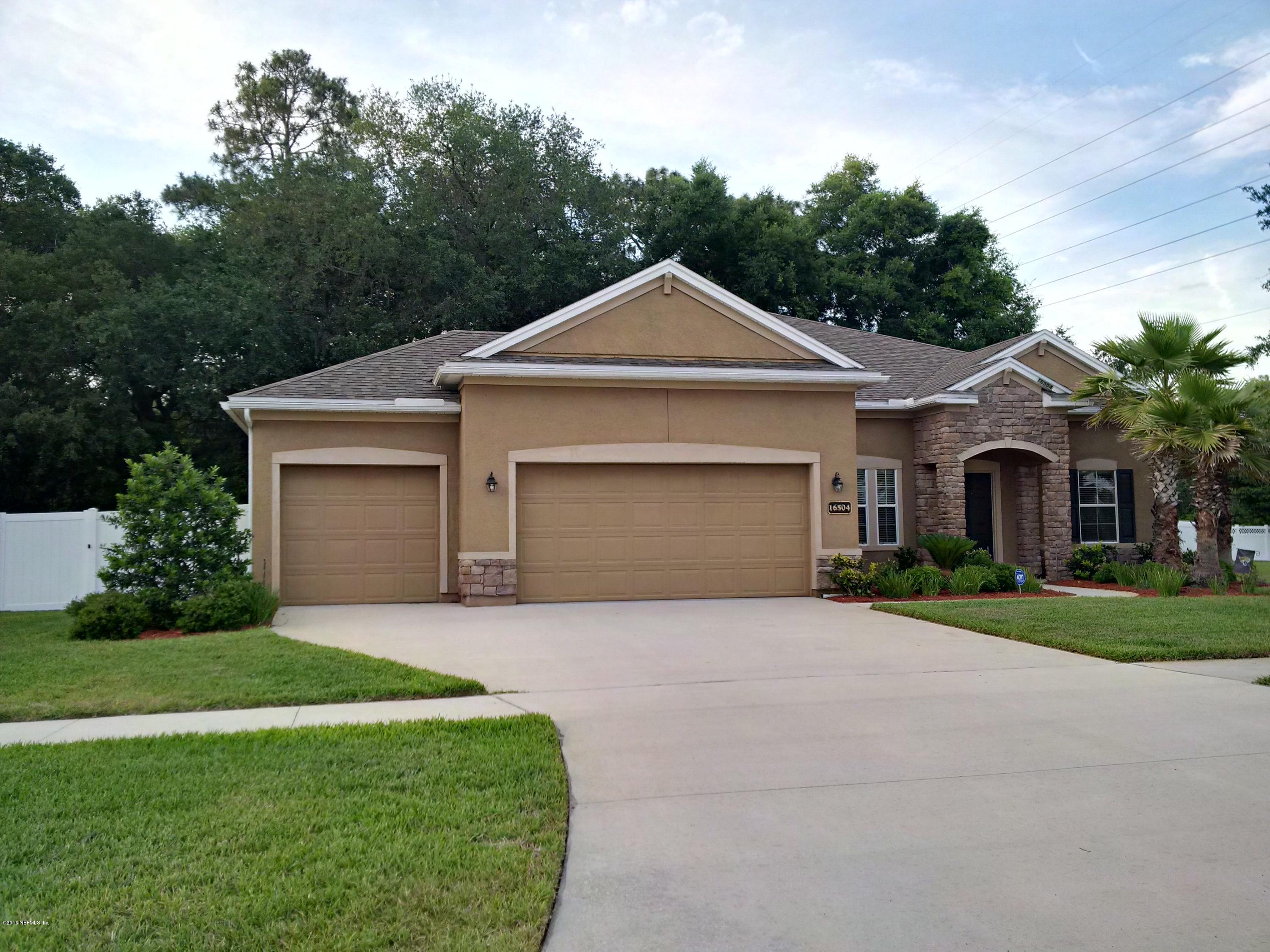 16504 Tisons Bluff Road Jacksonville, FL 32218 - Photo 1 of 34 a front view of a house with a yard and garage