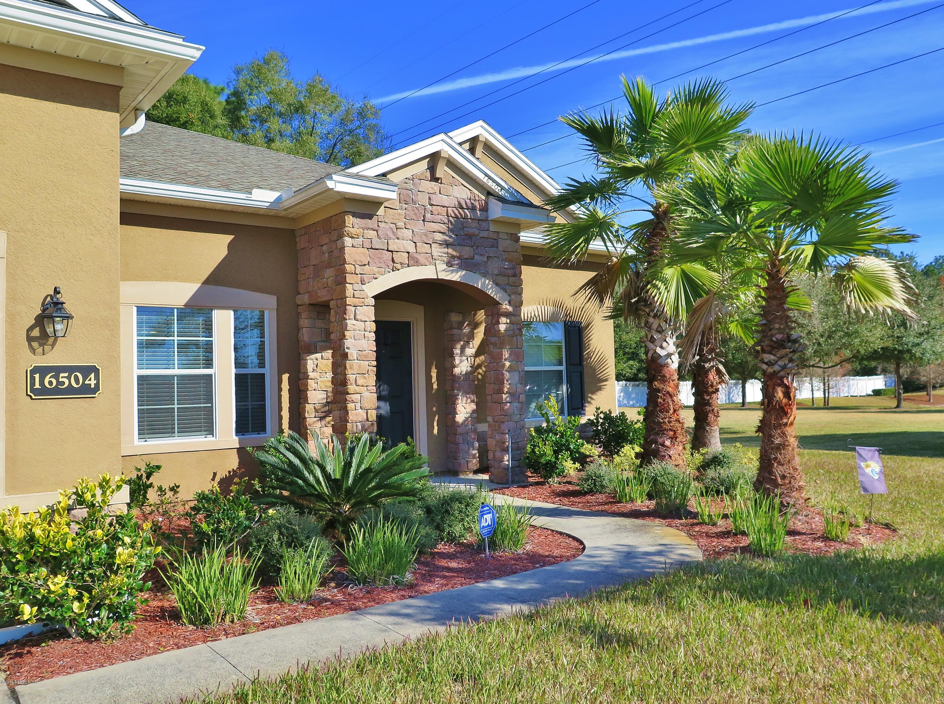16504 Tisons Bluff Road Jacksonville, FL 32218 - Photo 2 of 34 a front view of a house with garden