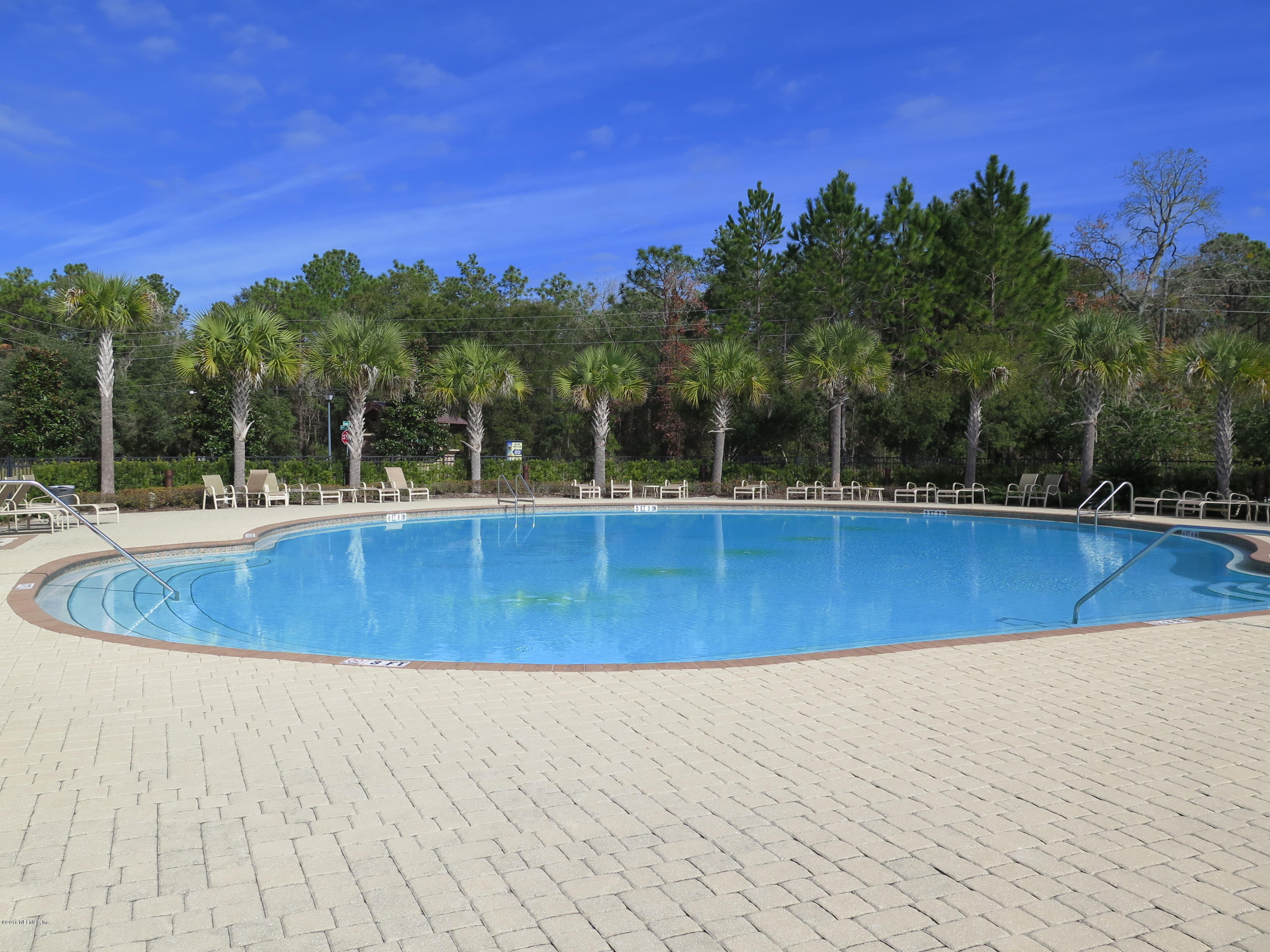 16504 Tisons Bluff Road Jacksonville, FL 32218 - Photo 30 of 34 a view of a swimming pool with trees in the background