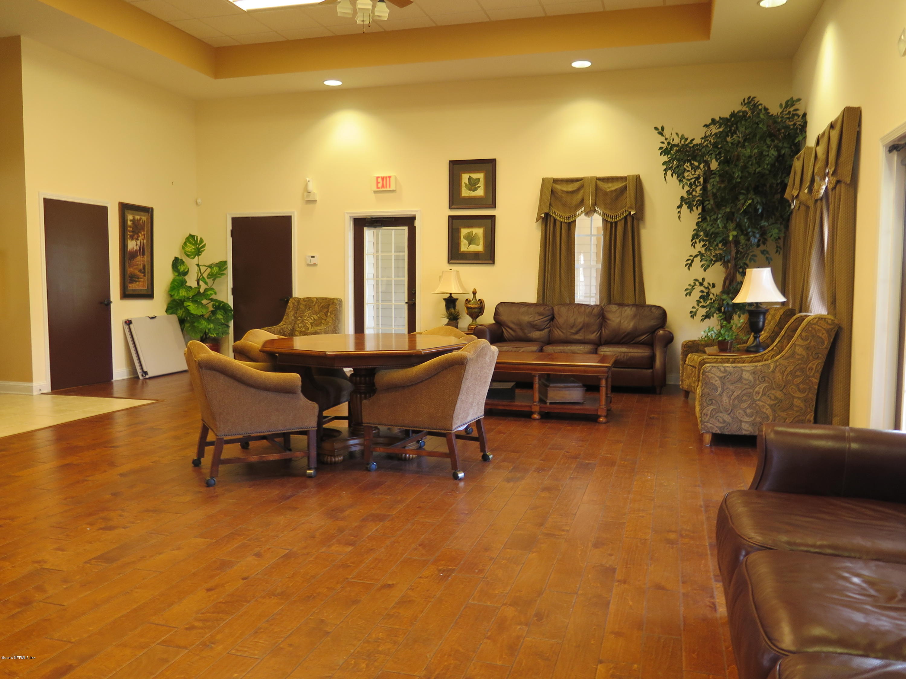 16504 Tisons Bluff Road Jacksonville, FL 32218 - Photo 33 of 34 a living room with furniture and a large window