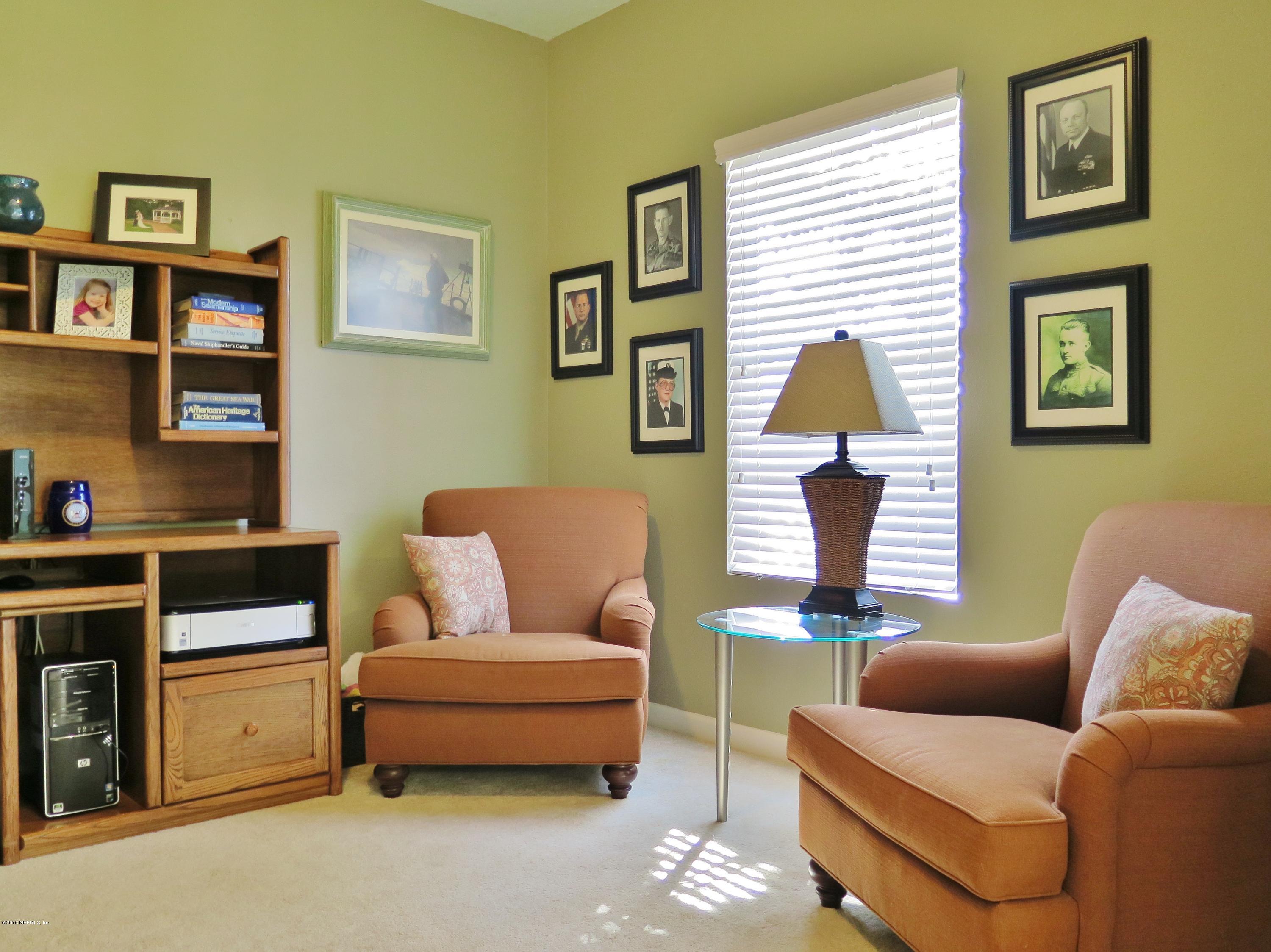 16504 Tisons Bluff Road Jacksonville, FL 32218 - Photo 6 of 34 a living room with furniture and a window