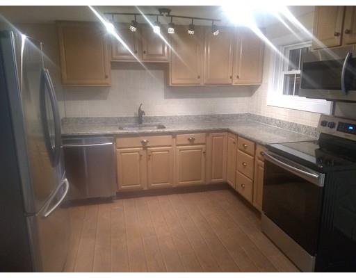31 Echo Road Brimfield, MA 01010 - Photo 8 of 26 a kitchen with stainless steel appliances granite countertop a sink stove and refrigerator