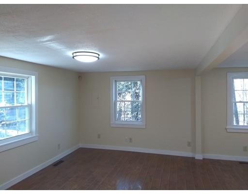 31 Echo Road Brimfield, MA 01010 - Photo 9 of 26 an empty room with wooden floor and windows