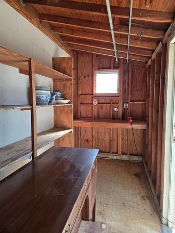 a view of backyard with seating space and trees