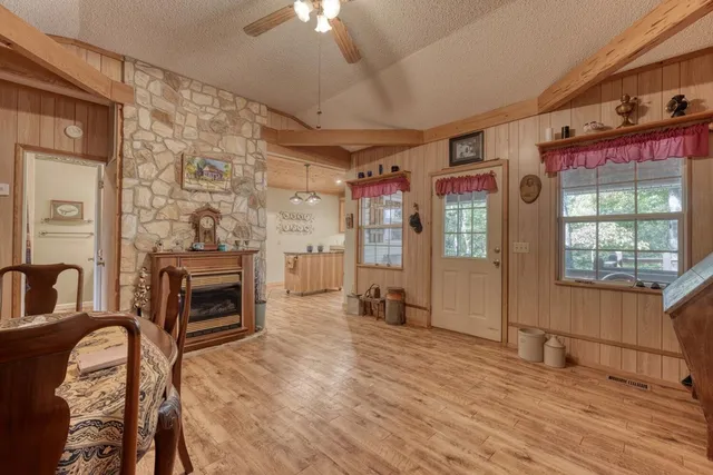a living room with furniture windows and a fireplace