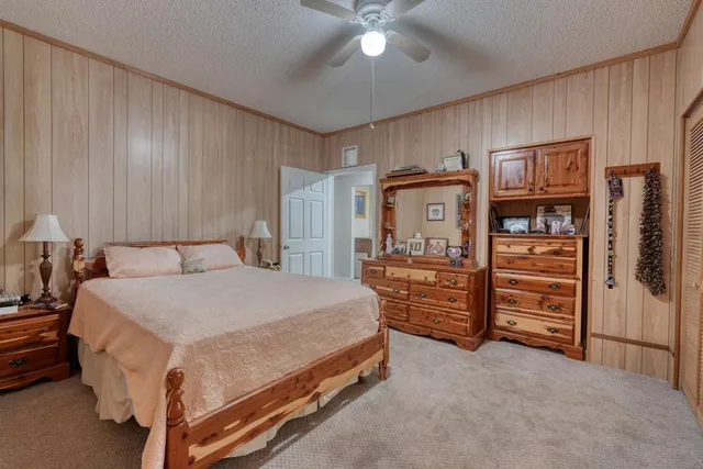 a bedroom with a bed and a walk in closet