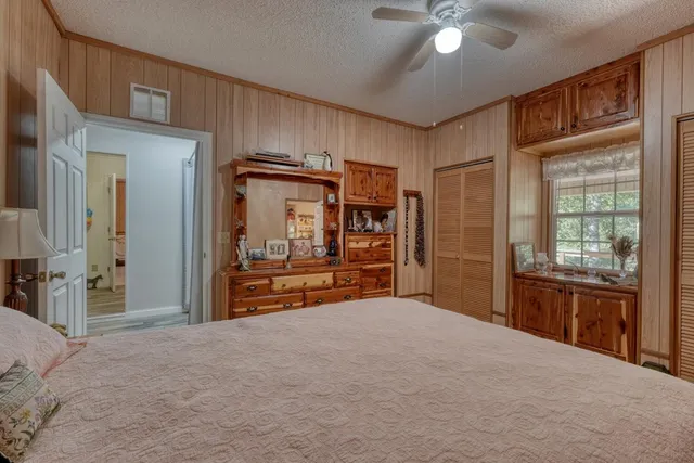 a bedroom with furniture and window