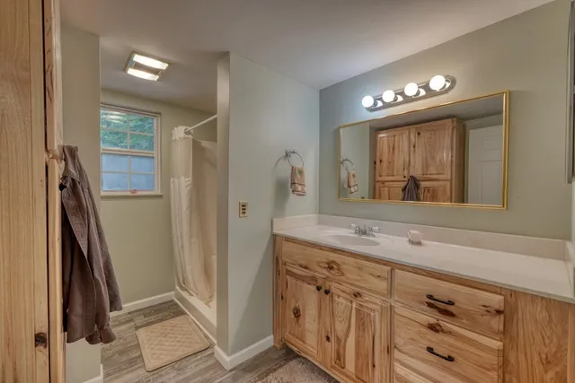 a bathroom with a sink a vanity and a mirror