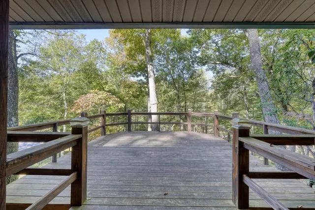 a view of a balcony with wooden floor