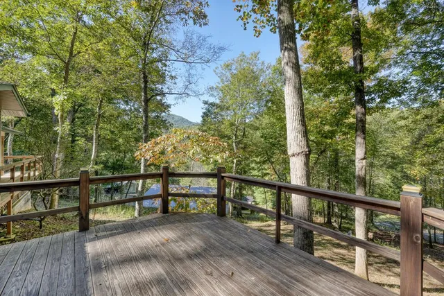 a view of a patio with table and chairs and wooden floor
